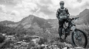 Suunto mountain biker high in the mountains in black and white