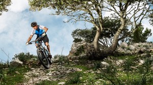 Suunto mountain biker on a technical path